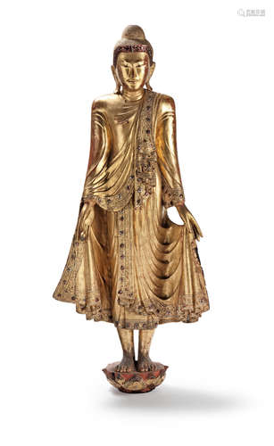 Burma, 19th/20th century A large glass-inset gilt-wood standing figure of Buddha