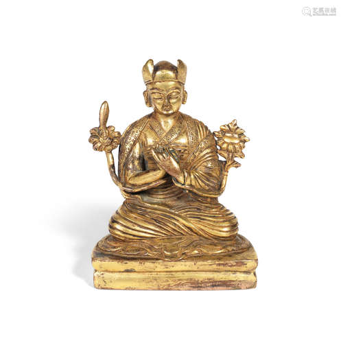 19th century A gilt-bronze figure of a lama