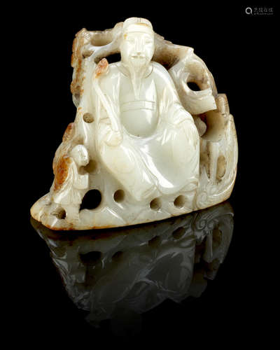 Ming Dynasty A white and russet jade boulder carving of seated Daoist scholar