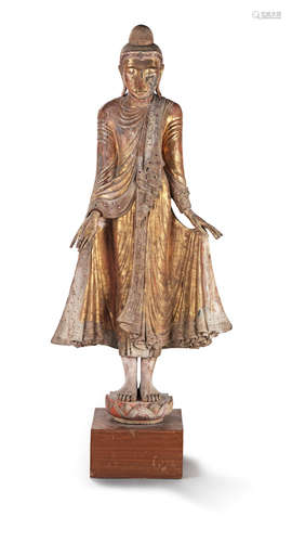 Thailand, 20th century A monumental gilt-lacquered wood figure of the standing Buddha