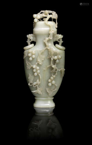 20th century A large pale green jade 'squirrels and grapevines' baluster vase and cover