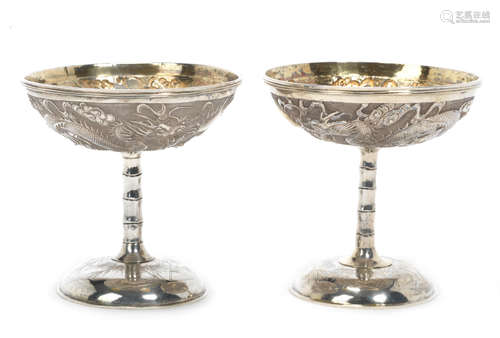 Late 19th century An unusual pair of Chinese export siver stem cups