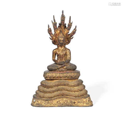 Thailand, Bangkok, Rattanakosin-style, 19th/20th century A gilt-lacquered copper-alloy figure of Buddha under Muchalinda