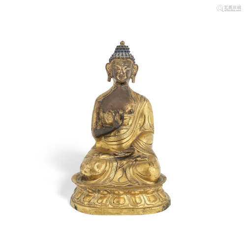 18th/19th century A parcel gilt copper-alloy repoussé figure of Buddha Amogasiddhi