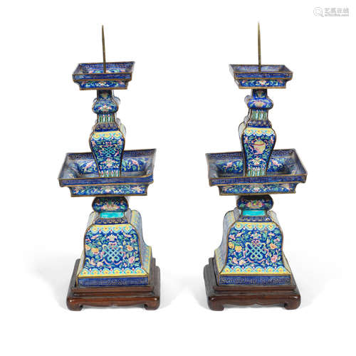 19th century A pair of painted enamel 'Buddhist Emblems' pricket candle sticks