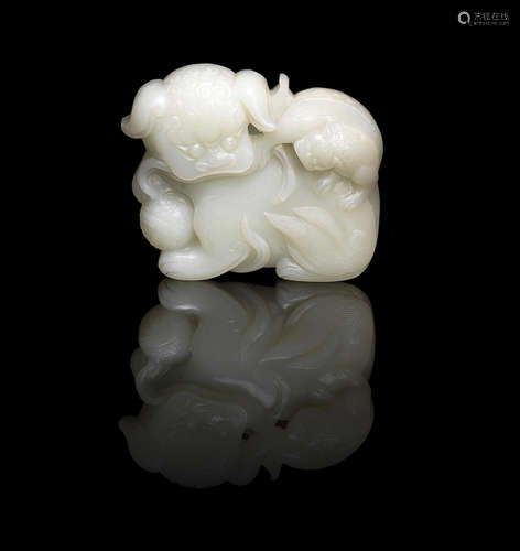 18th century A pale green jade 'Buddhist lion and cub' belt plaque