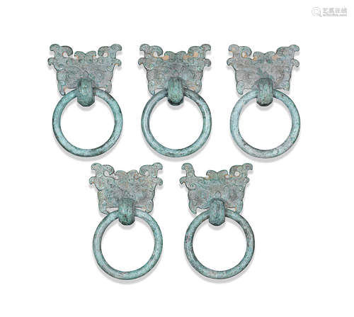 Eastern Zhou Dynasty A set of five archaic bronze 'Taotie mask' ring handles, pushou