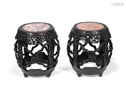 19th century A matched pair of marble-inset hardwood barrel stools