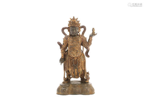 Ming Dynasty A painted and gilt bronze figure of the Guardian king of the North