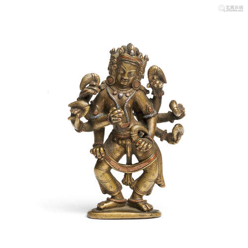 Tibet or Nepal, 18th/19th century or earlier A copper and silver inlaid copper-alloy eight-armed deity