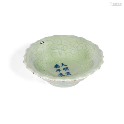 Xuande six-character mark A small celadon-glazed foliate dish