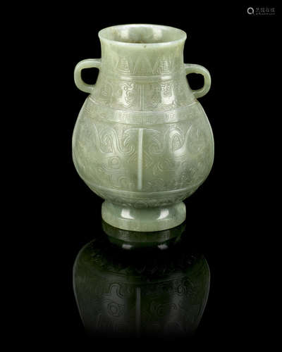 Qing Dynasty A green hardstone archaistic hu-form vase