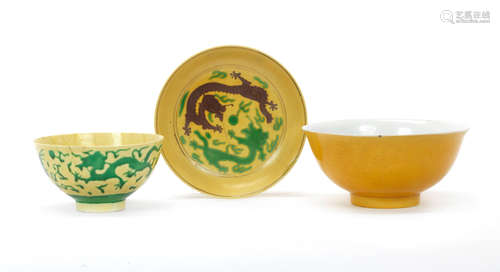 Qianlong seal mark and of the period A yellow-glazed anhua decorated 'dragon' bowl