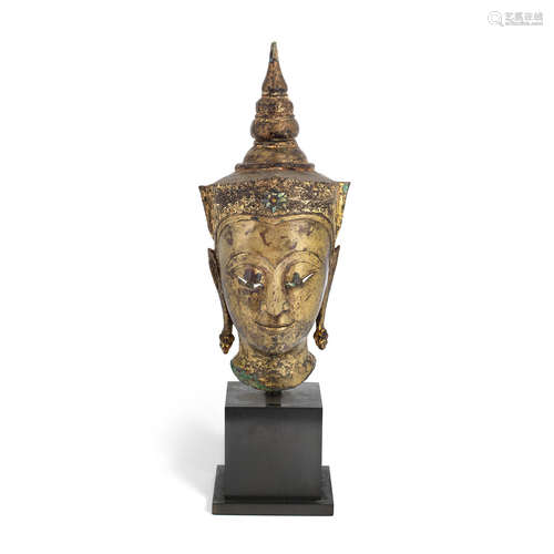 Thailand, Ayutthaya period, circa 17th century A gilt-lacquered brass-alloy crowned Buddha head