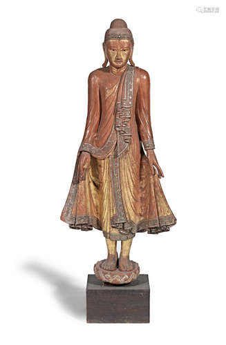 Burma, 19th/20th century A large glass-inset gilt-lacquered wood figure of Buddha