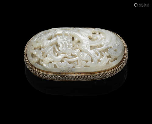 The jade: 16th/17th century, the buckle: Qing Dynasty A green jade 'dragon' inset gilt-bronze belt buckle