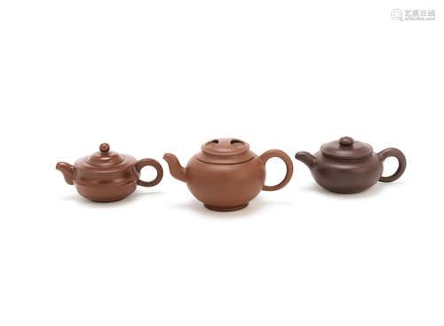 20th century A group of three Yixing teapots and covers