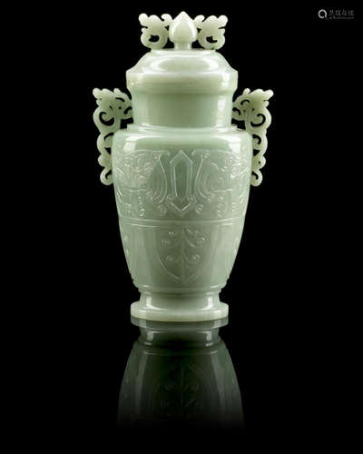 Qing Dynasty A pale green hardstone carved baluster vase and cover