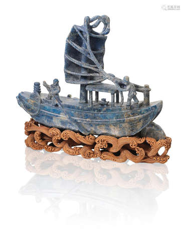 Late Qing Dynasty/ Republic Period A lapis lazuli carving of a sailing boat with two figures