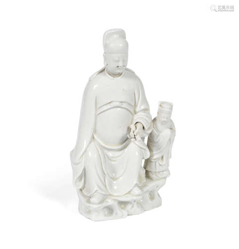 17th century  A blanc-de-Chine figure of Wenchang and acolyte