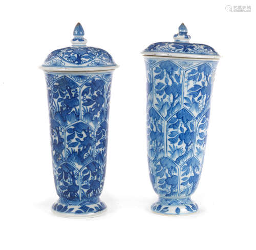 Kangxi A matched pair of blue and white beaker vases and covers