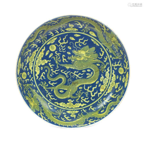 Qianlong seal mark and of the period An underglaze blue-ground yellow enamelled 'dragon' dish