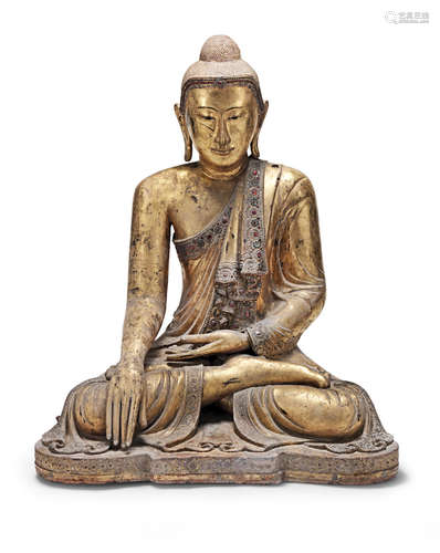 Burma, 19th/20th century A gilt-lacquered and glass-inset copper-alloy seated figure of Buddha