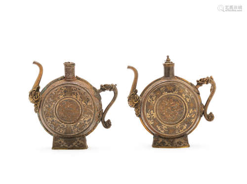 Tibet, 18th century A pair of gold, silver and copper damascened iron beer ewers