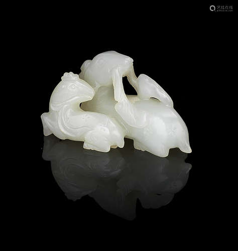 A white jade carving of a deer and fawn