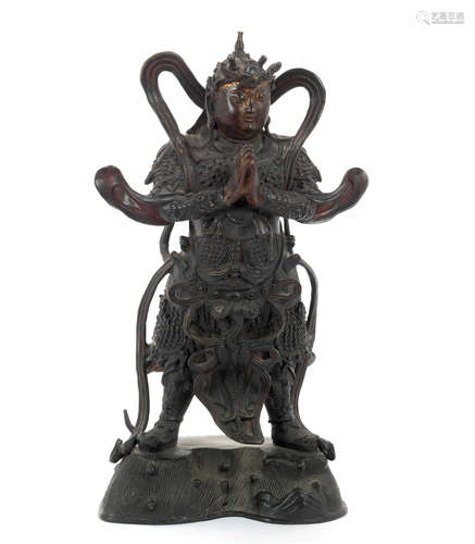 Ming Dynasty, 17th century A large bronze figure of a Buddhist Guardian of the Four Directions