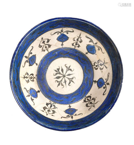 A Kashan underglaze-painted pottery bowl Persia, 12th/ 13th Century