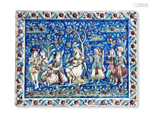 A large Qajar underglaze-painted moulded pottery tile Persia, circa 1880