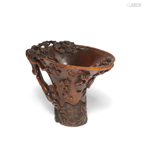 17th/18th century  A carved rhinoceros horn 'chilong and pine' libation cup