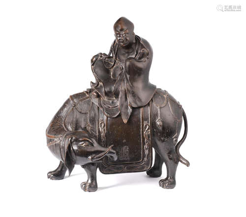 Ming Dynasty A large bronze 'elephant and Luohan' incense burner and cover