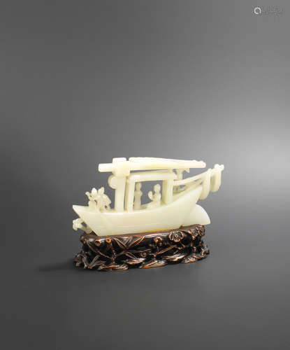 19th century A white jade carving of a sampan with figures