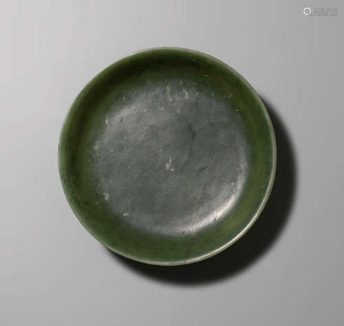 Qianlong seal mark and of the period A spinach-green jade dish