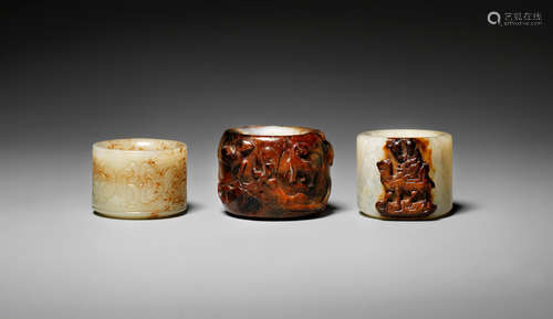 17th/18th century Three white and russet jade thumb rings