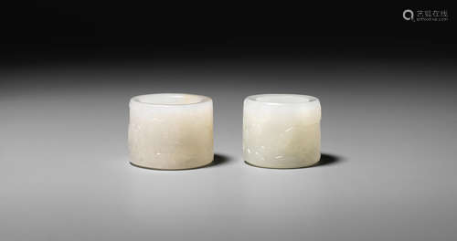 Mid-Qing Dynasty Two white jade 'horse' thumb rings