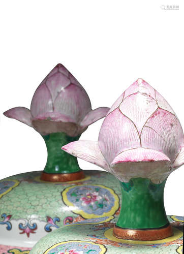 Qianlong A rare and large pair of famille rose 'blossoming-lotus' baluster vases and covers