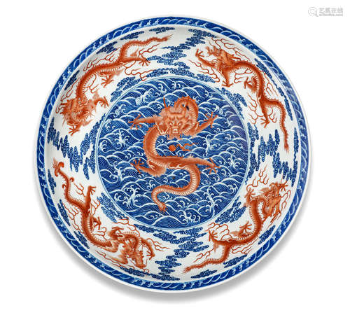 Qianlong seal mark and of the period An exceptionally rare and large Imperial underglaze-blue and iron-red enamel 'nine dragon' dish