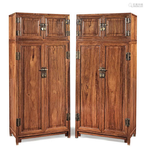 A pair of large huanghuali compound cabinets with chests