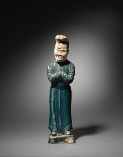Tang Dynasty  A rare blue-glazed pottery figure of a male attendant