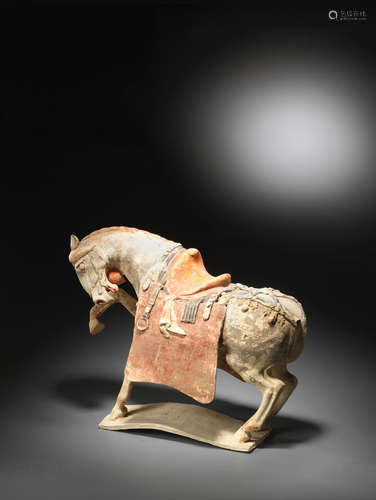 Tang Dynasty  A rare painted pottery figure of a prancing horse