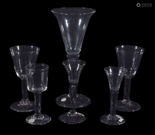 Five various plain-stemmed wine glasses