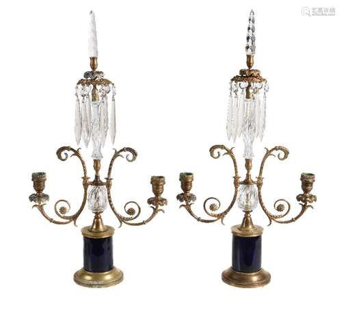 A pair of Regency brass and glass twin light lustre candelabra