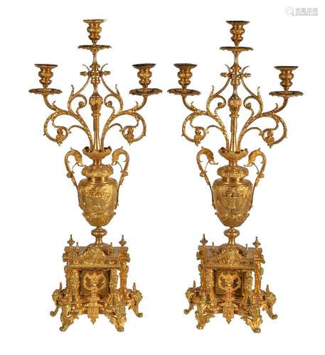 A pair of French gilt metal three light candelabra in Louis XIV taste