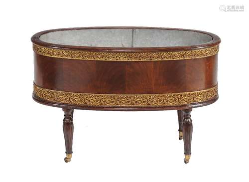 A mahogany and gilt metal mounted jardiniere or wine cooler in George III style