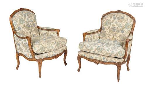 A pair of Louis XV style walnut armchairs