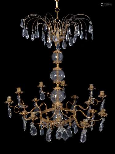 A Continental, probably Russian gilt metal and cut glass hung fifteen light chandelier