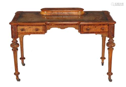 A Victorian walnut writing table